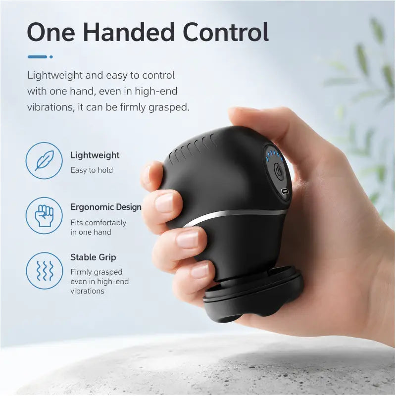A woman holding a compact black massage device on her open palm, illustrating lightweight and easy one-handed control.